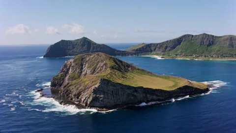 Rugged island surrounded by the deep blue sea. Stock Footage 297397993