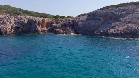 Rugged Limestone Cove and Turquoise Sea, Greece Stock Footage 343735089