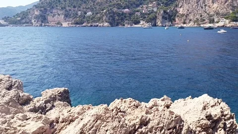 Rugged limestone rocks and blue sea at Cap d’Ail on the French Riviera. Stock Footage 342558971
