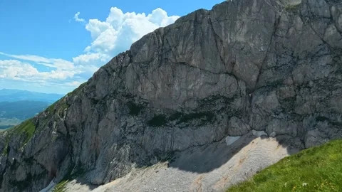 Rugged mountain face towers above lush green slopes. Savin Kuk peak, Montenegro Vídeos de archivo 342979675