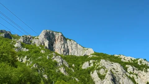 Rugged mountain face under clear blue sky. Ovcar Kalbar Gorge, Serbia Видео 333843892