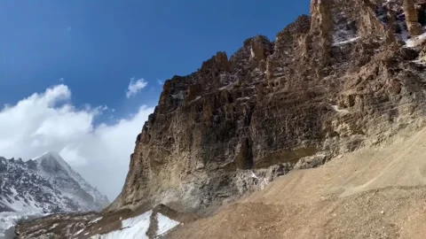 Rugged Mountain Landscape with Snow Peaks and Blue Sky Ngari Tibet China 動画素材 346737686