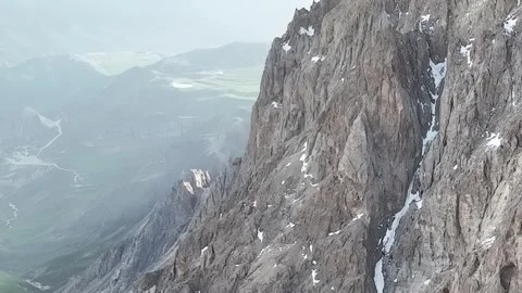 Rugged Mountain Landscape with Snow Pockets and Valley View Stock Footage 341894145