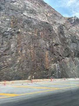 Rugged Mountain Roadside Cliff 스톡 사진