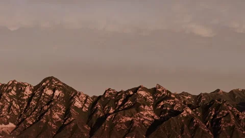 Rugged Mountain Rock Face and Cliffs at Twilight Push In 4K HLG Stock Footage 344014399