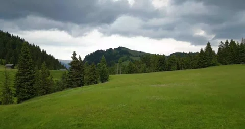 A rugged mountainous landscape beneath dramatic stormy skies Stock Footage 320174098