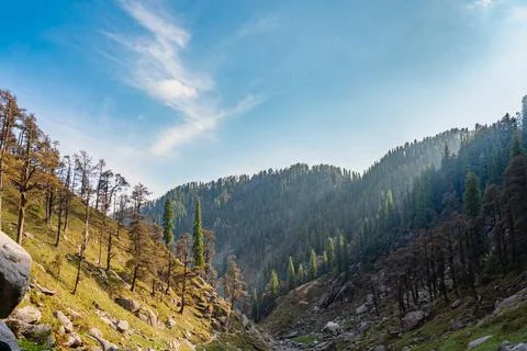 Rugged mountains beneath dramatic cloudy skies Stock Photos