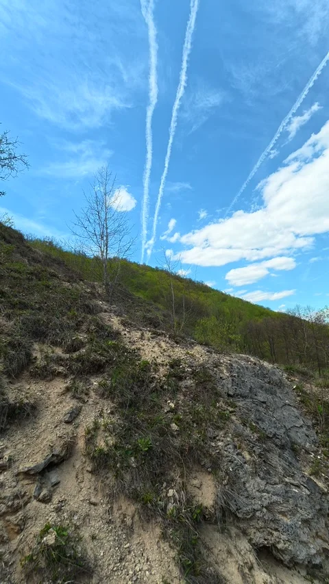 Rugged path winds up a rocky hillside. Bigar Waterfall, Serbia. Vertical Video stock 333699975
