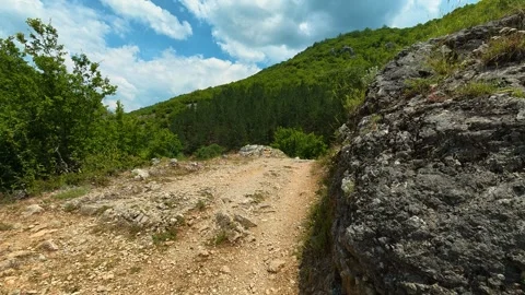 Rugged path winds through forested mountainside. Gradasnica River Canyon, Serbia Vídeo Stock 341961855