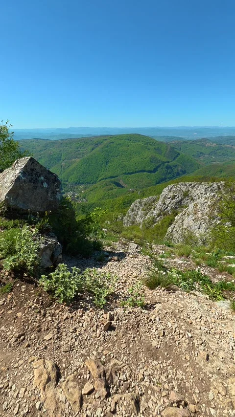 Rugged path winds through rocky terrain. Ovcar Kablar Gorge, Serbia. Vertical 스톡 동영상 334223678