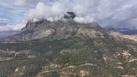 Rugged peak with cloudy skies, Dramatic mountain landscape with swirling clouds Stock Footage 325000667