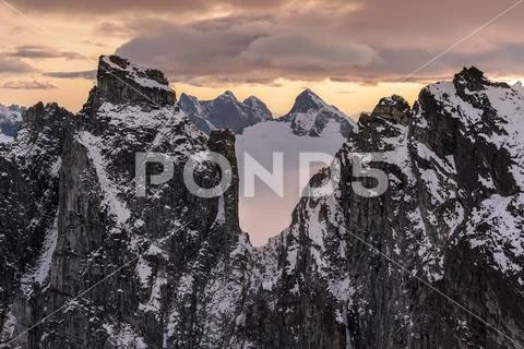 Rugged peaks and snow-covered glaciers at sunset, Juneau Icefield, Tongass Natio Stock Photos