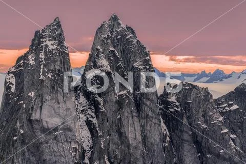 Rugged peaks and snow-covered glaciers at sunset, Juneau Icefield, Tongass Natio Stock Photos
