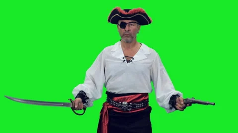 Rugged pirate with an eye patch posing with sword and pistol on green background 스톡 동영상 304294673
