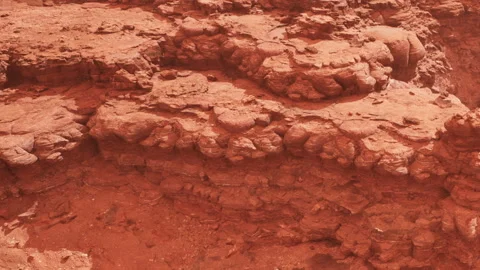 Rugged red rock formations in a desert landscape with layered texture Stock Footage 341799514