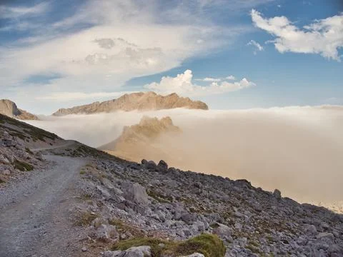 Rugged ridge above cloud inversion panorama - Elevated hiking trail on a ro.. Stock Photos