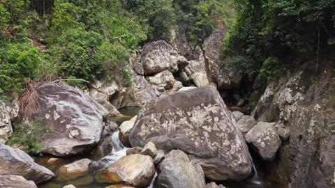 Rugged rocks line a clear, flowing stream 스톡 동영상 344900740