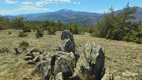 Rugged rocks stand tall on sunlit hillside. Balkan, Eastern Europe, POV Video stock 333441005