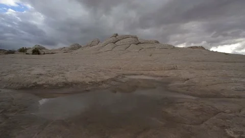 Rugged rocky landscape with storm clouds in timelpase form Stock Footage 169603744