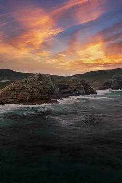 Rugged sandstone cliffs at Cape of Good Hope under sunset sky Foto stock