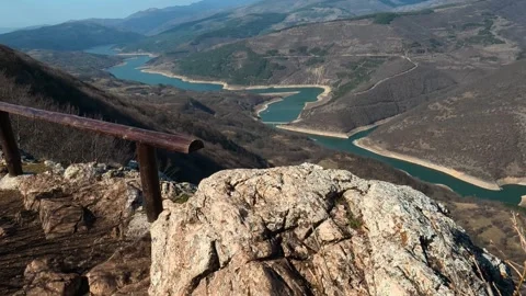 Rugged stone rises from earthy ground. Balkan, Eastern Europe, POV Video stock 331815038