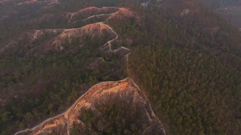 Rugged terrain and narrow paths lit by first light over Pai, Thailand Stock-Footage 309239969