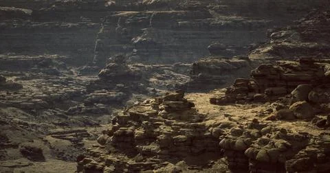 Rugged terrain showcasing layered rock formations under soft light Stock Illustration