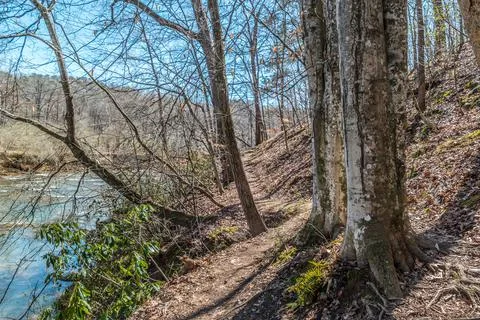 Rugged trail along the river Stock Photos