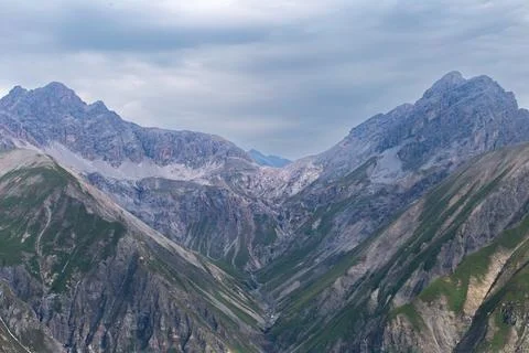 Rugged V Shaped Mountain Gorge and Peaks Stock Photos