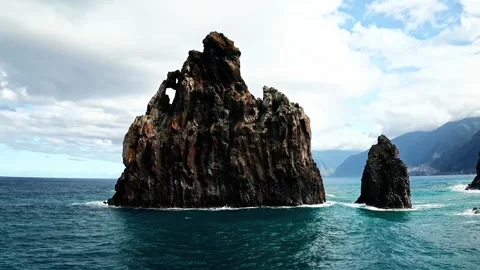Rugged volcanic rock formation rising from Atlantic ocean near Madeira. Stock-Footage 341071284