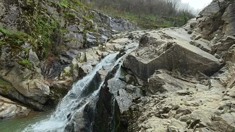 Rugged Waterfall Rocks 4K - Side View of Powerful Flow &amp; Ancient Stone Vídeos de archivo 332146922