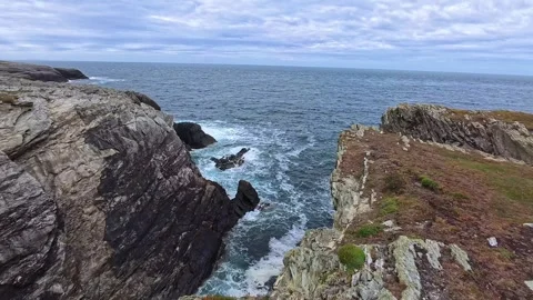 Rugged Welsh coastal cliffs looking across Irish seascape Видео 337924261