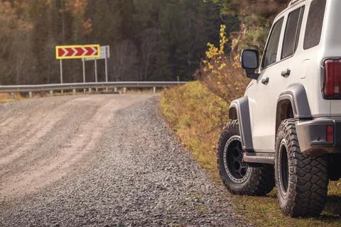 A rugged white SUV is parked Stock Photos