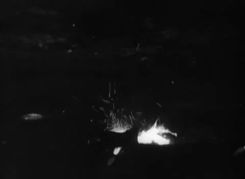 RUHR, GERMANY - 1948: Hot sample - White-hot metal sprays sparks on a dark base Stock Footage 344494622