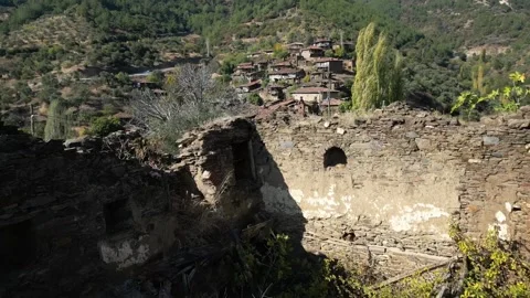 A ruin view then flies over the abandoned lubbey village Stock Footage 221274342