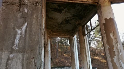 The ruined architecture of the building, cracks, bare concrete, old columns, a Stock Footage 166809609