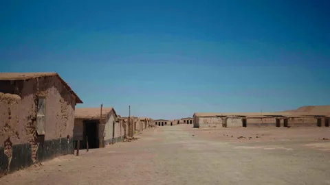 Ruined buildings lining both sides of Chacabuco camp alley 库存影片 337874590