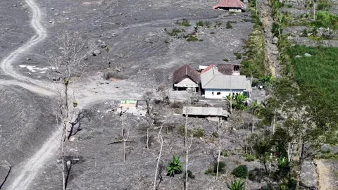 Ruined concrete structures and collapsed roofs in an abandoned rural village Video stock 346919809