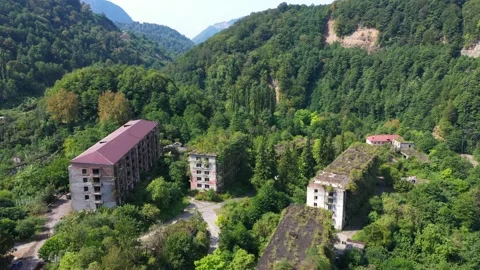 Ruined lost overgrown mining ghost town Akarmara, consequences of war in Video stock 149726324