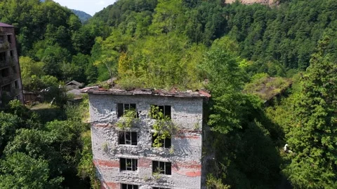 Ruined lost overgrown mining ghost town Akarmara, consequences of war in Video stock 149726633