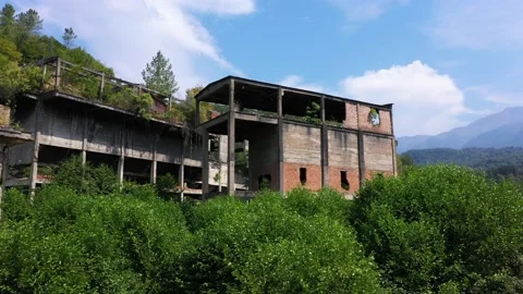 Ruined lost overgrown mining ghost town Akarmara, consequences of war in Stock Footage 152554374