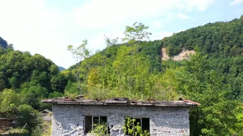 Ruined lost overgrown mining ghost town Akarmara, consequences of war in Stock Footage 152554437