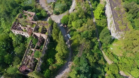 Ruined lost overgrown mining ghost town Akarmara, consequences of war in Stock Footage 152970160