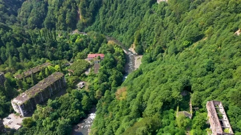 Ruined lost overgrown mining ghost town Akarmara, consequences of war in Stock Footage 154964418