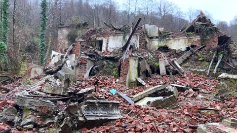 The ruined, lost, overgrown mining ghost town of Akarmara in the rain Stock Footage 304188909