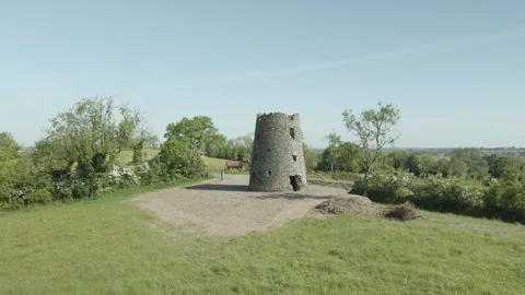 Ruined Medieval Celtic Round Tower In Green Field, Midlands, Ireland - Stock Footage 250774992