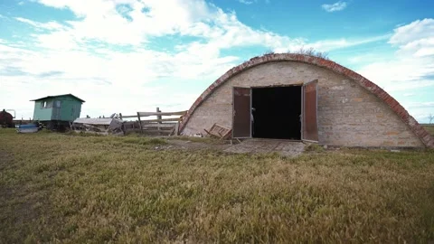 A ruined ranch without cows, pigs, sheep, animals. Empty stable, storage. Stock Footage 152533909
