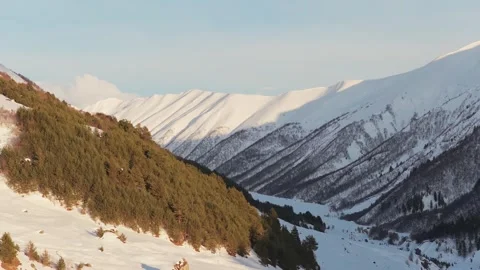 Ruined stone Svan tower standing on a pristine, snow-covered slope in the h.. Stock Footage 333294377