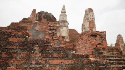 Ruins of an ancient Buddhist temple with close up of red brick walls and stupa Video stock 312916896