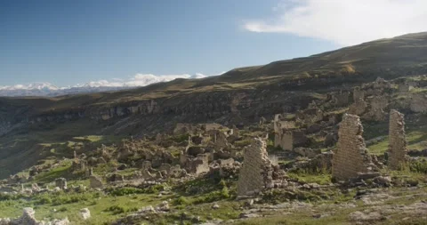 Ruins of an ancient settlement in the mountains Video stock 232136940